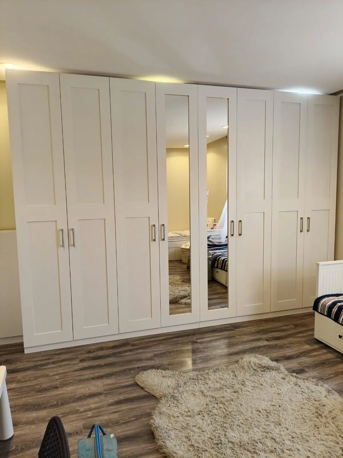 White fitted wardrobe with mirrors